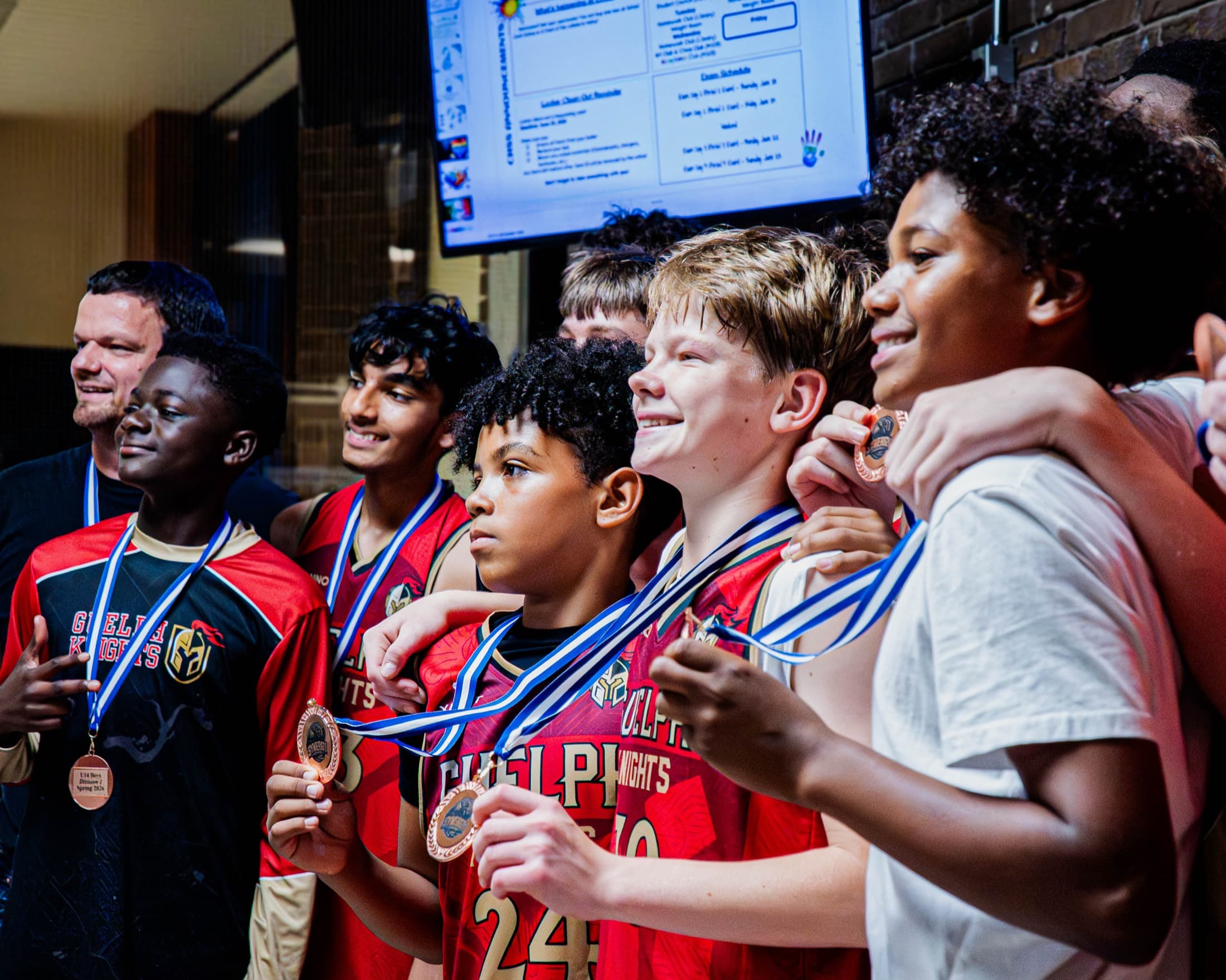 Players celebrating with medals after a Synergy Leagues final