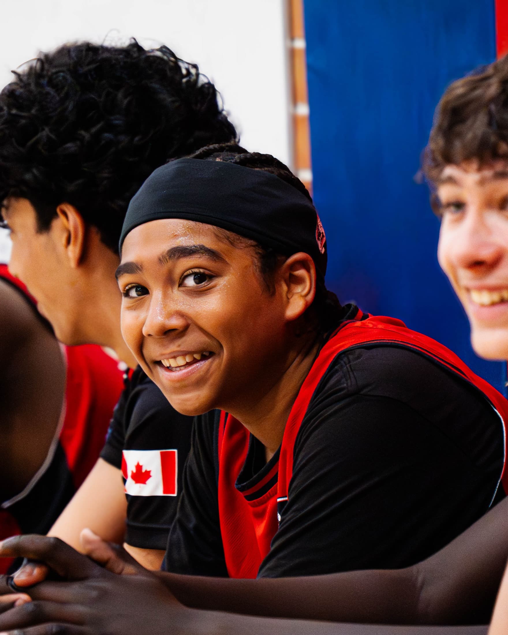 Two Synergy Leagues teammates sharing a moment courtside